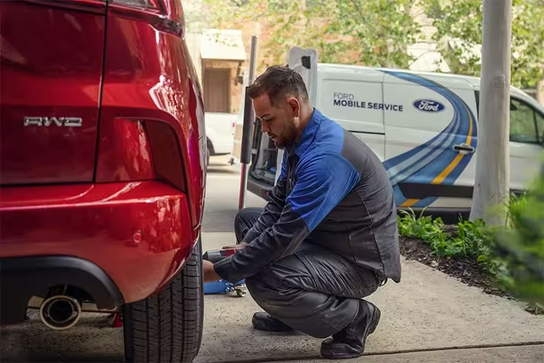 A ford technician performing a mobile tire service!